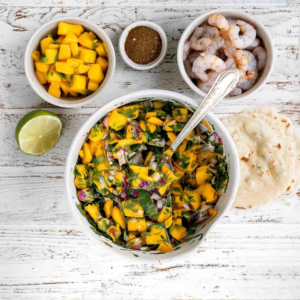 Shrimp cooking in skillet with jerk seasoning